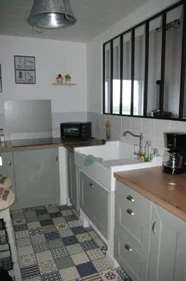 Cuisine ou kitchenette dans l'établissement Au charme d'antan