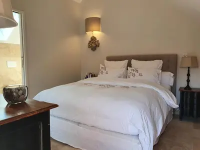 Un ou plusieurs lits dans un hébergement de l'établissement Les Vieilles Pierres chambres d'hôtes