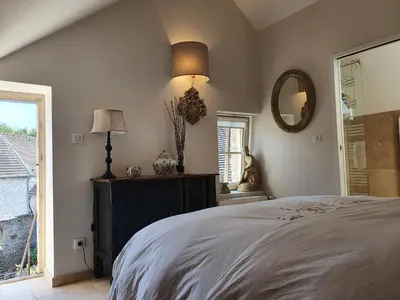 Un ou plusieurs lits dans un hébergement de l'établissement Les Vieilles Pierres chambres d'hôtes