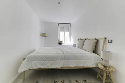 Un ou plusieurs lits dans un hébergement de l'établissement Natural chic au coeur de Reims