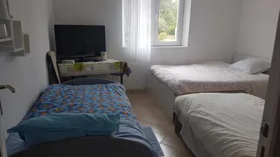 Un ou plusieurs lits dans un hébergement de l'établissement SUPER SPACIEUX GÎTE PROCHE DE TOUTES COMMODITÉS