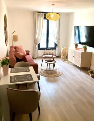 Télévision ou salle de divertissement dans l'établissement Les Bulles Blanches