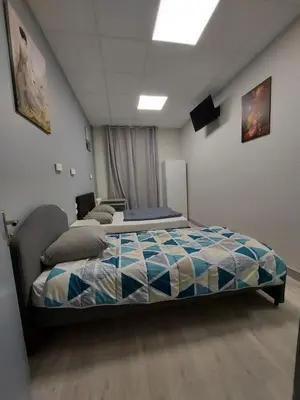 Un ou plusieurs lits dans un hébergement de l'établissement Ardenn'Hotel