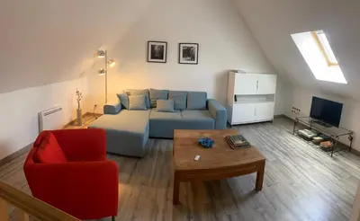 Coin salon dans l'établissement Confortable duplex au cœur de la campagne Picarde à 1h de Paris