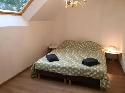Un ou plusieurs lits dans un hébergement de l'établissement Maison de campagne
