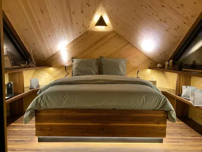 Un ou plusieurs lits dans un hébergement de l'établissement LA RÉSERVE DE L'AUBE - Hébergements insolites Luxe et Design