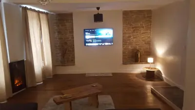 Télévision ou salle de divertissement dans l'établissement Appartement spacieux et atypique