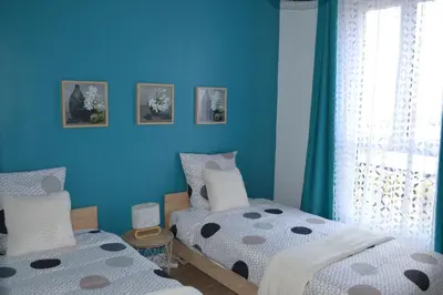 Un ou plusieurs lits dans un hébergement de l'établissement ESCALE À ÉPERNAY BORDS DE MARNE APPT 2/4 PERS