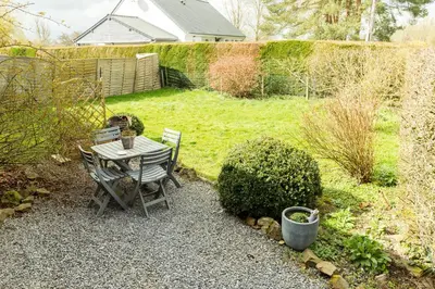 Jardin de l'établissement Studio Bienvenue du côté de chez nous avec jardin privatif