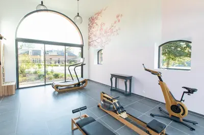 Salle ou équipements de sports de l'établissement Aux Petits Lapins de Sorval, sauna privé, fitness