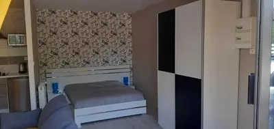 Un ou plusieurs lits dans un hébergement de l'établissement Charmante petite maison