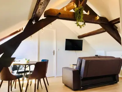 Télévision ou salle de divertissement dans l'établissement AU PETIT BONHEUR