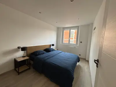 Un ou plusieurs lits dans un hébergement de l'établissement Appartement de Adrien Garage privé