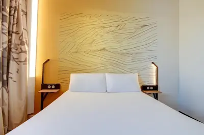 Un ou plusieurs lits dans un hébergement de l'établissement B&B HOTEL Epernay