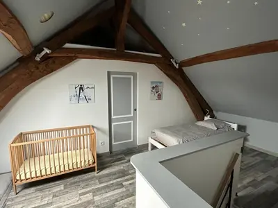 Un ou plusieurs lits dans un hébergement de l'établissement Maison de village chez Josy