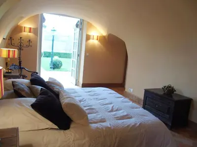 Un ou plusieurs lits dans un hébergement de l'établissement La chambre des vignerons
