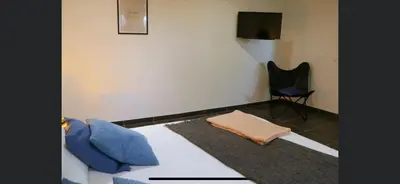 Télévision ou salle de divertissement dans l'établissement Aux Fines Bulles Chambres d hôtes