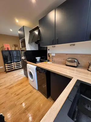 Cuisine ou kitchenette dans l'établissement Le coin qu on M