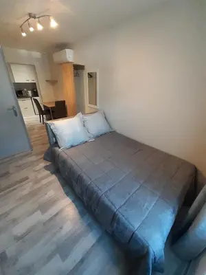 Un ou plusieurs lits dans un hébergement de l'établissement Les appartements du Saint Hubert