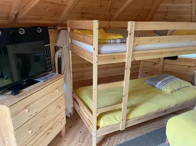 Un ou plusieurs lits dans un hébergement de l'établissement Kota à la ferme
