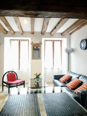 Coin salon dans l'établissement Cottage AU TERMINUS 3 climatisé