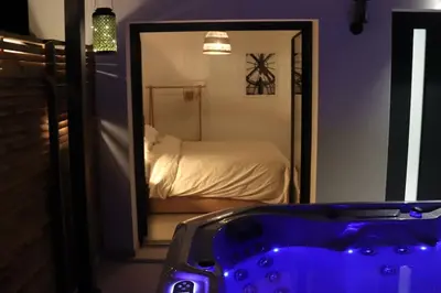 Un ou plusieurs lits dans un hébergement de l'établissement SPA & SERENITE, aux Portes de Disney et de Paris