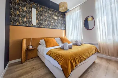 Un ou plusieurs lits dans un hébergement de l'établissement Les Appartements de la Nef d'Or