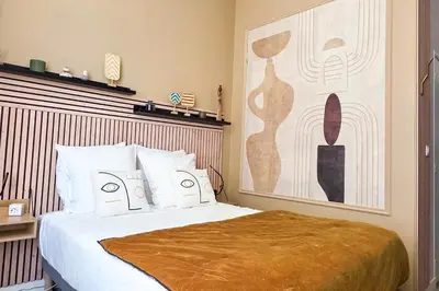 Un ou plusieurs lits dans un hébergement de l'établissement Les Appartements de la Nef d'Or
