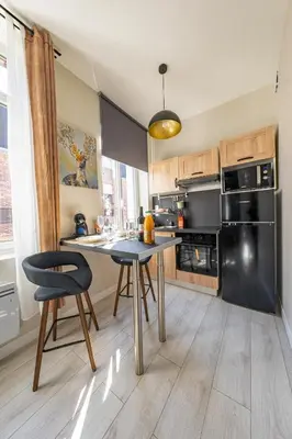 Cuisine ou kitchenette dans l'établissement Les Appartements de la Nef d'Or