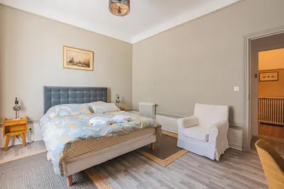 Un ou plusieurs lits dans un hébergement de l'établissement MOULINS - Maison cosy au cœur de Reims