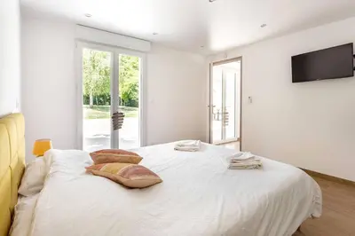 Un ou plusieurs lits dans un hébergement de l'établissement La Grignotière Lodge & Spa