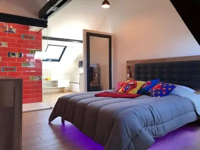 Un ou plusieurs lits dans un hébergement de l'établissement Maison avec garage Pop' Appart'