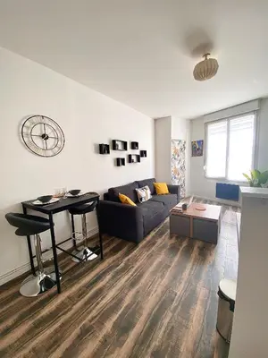 Coin salon dans l'établissement Suite Romain, appartement en centre ville