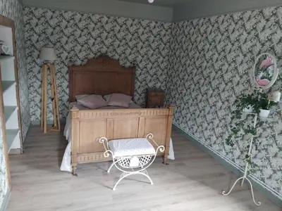 Un ou plusieurs lits dans un hébergement de l'établissement Charmante maison avec cheminée, grand jardin et boxe chevaux