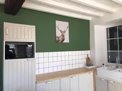 Cuisine ou kitchenette dans l'établissement Villa Verger vakantiewoning 12 personen