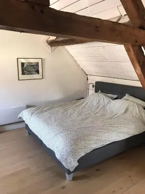 Un ou plusieurs lits dans un hébergement de l'établissement Villa Verger vakantiewoning 12 personen
