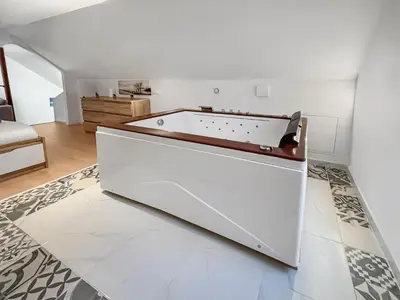 Un ou plusieurs lits dans un hébergement de l'établissement Évasion détente avec Jacuzzi Sauna & Billard