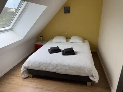 Un ou plusieurs lits dans un hébergement de l'établissement Le Relais de la Fontaine & Jacuzzi