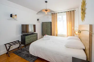 Un ou plusieurs lits dans un hébergement de l'établissement Suites Mana - Le Manaloft, Chic et moderne avec salle privée de Fitness en plein centre-ville de Rethel
