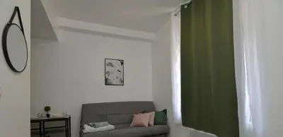 Coin salon dans l'établissement Home Group