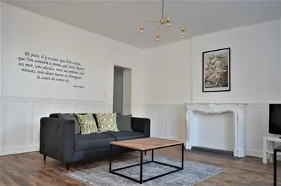 Coin salon dans l'établissement Appartement La palette