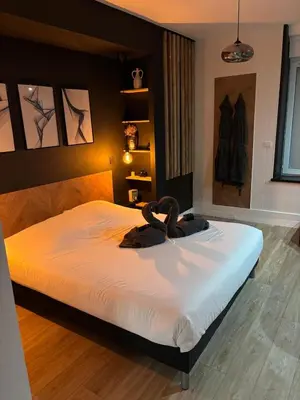 Un ou plusieurs lits dans un hébergement de l'établissement CK Suite & Spa - Jacuzzi Privatif - Reims