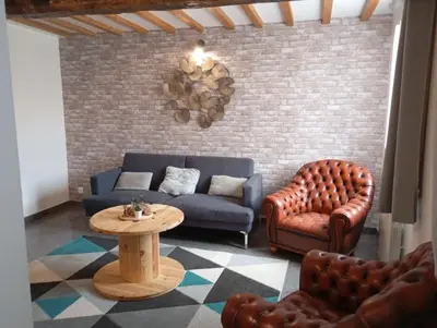 Coin salon dans l'établissement Maison au calme