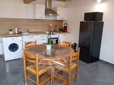 Cuisine ou kitchenette dans l'établissement Maison au calme