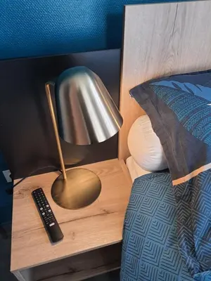 Un ou plusieurs lits dans un hébergement de l'établissement Hôtel de Guise SARL
