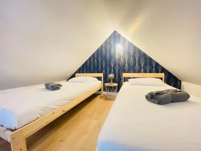 Un ou plusieurs lits dans un hébergement de l'établissement Maison Le Clos d'Ardon
