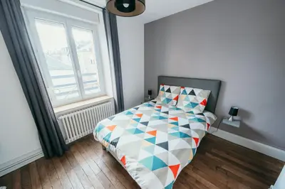 Un ou plusieurs lits dans un hébergement de l'établissement Appartement d'Alexandre hyper centre-ville
