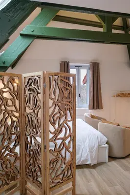 Un ou plusieurs lits dans un hébergement de l'établissement Villa Forestière Studio l'Olivier