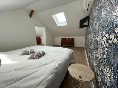 Un ou plusieurs lits dans un hébergement de l'établissement Gîte le Presbytère de Blérancourt