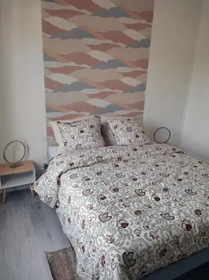 Un ou plusieurs lits dans un hébergement de l'établissement Superbe appartement bien placé